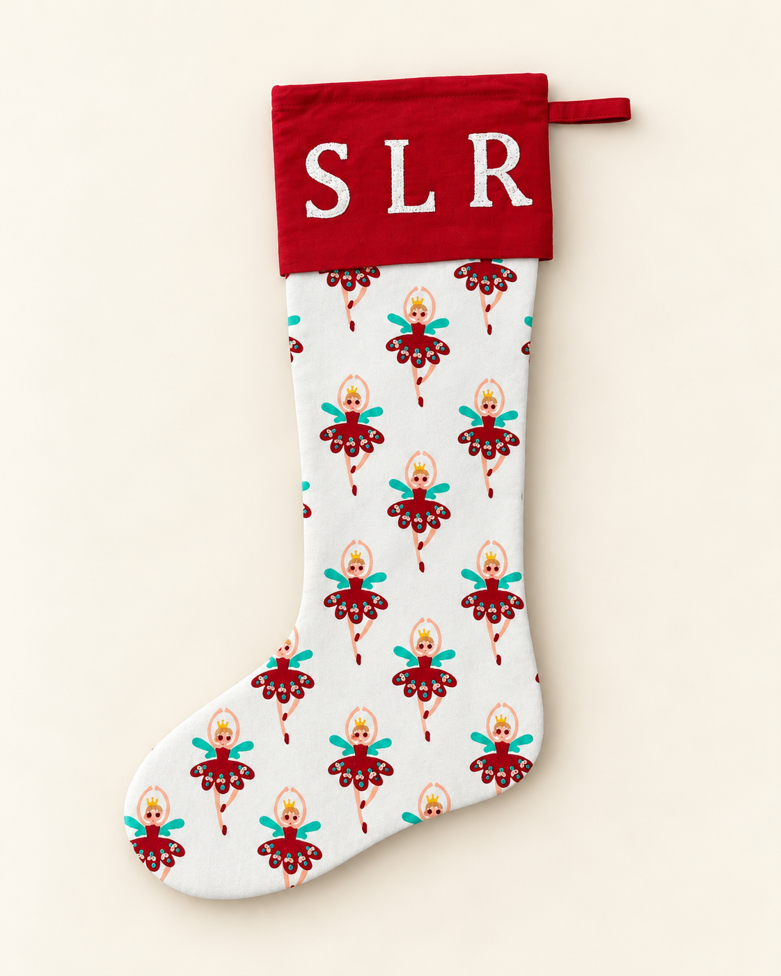 Personalised fairy Christmas stocking with red cuff and white embroidered initials.