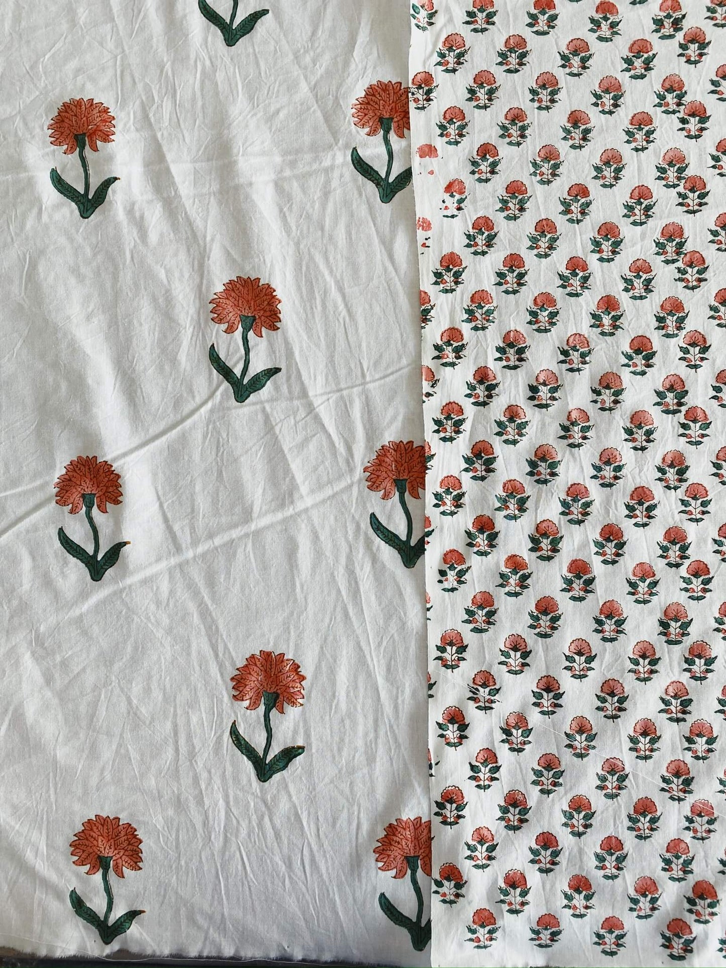 Two white and red floral pattern textiles side by side